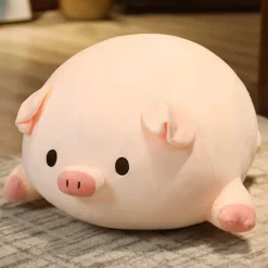 Peluche cochon allongé aux yeux ouverts