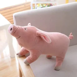 Peluche cochon rose mignon et content