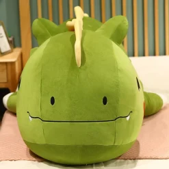 Peluche dinosaure avec un cœur sur la joue