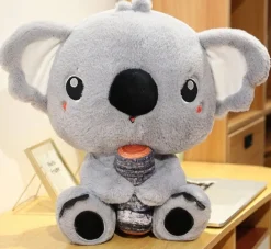 Peluche koala gris avec un gros nez