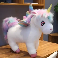 Peluche licorne arc-en-ciel blanche avec ailes et corne dorée