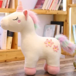 Peluche licorne blanche fleurie avec crinière arc-en-ciel