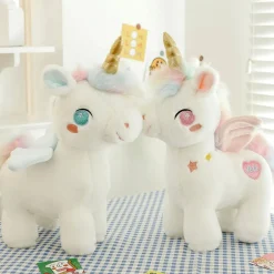 Peluche licorne blanche étoilée avec ailes et corne dorée