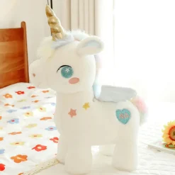 Peluche licorne blanche étoilée avec ailes et corne dorée