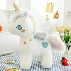 Peluche licorne blanche étoilée avec ailes et corne dorée