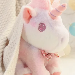 Peluche licorne douce pastel et arc en ciel