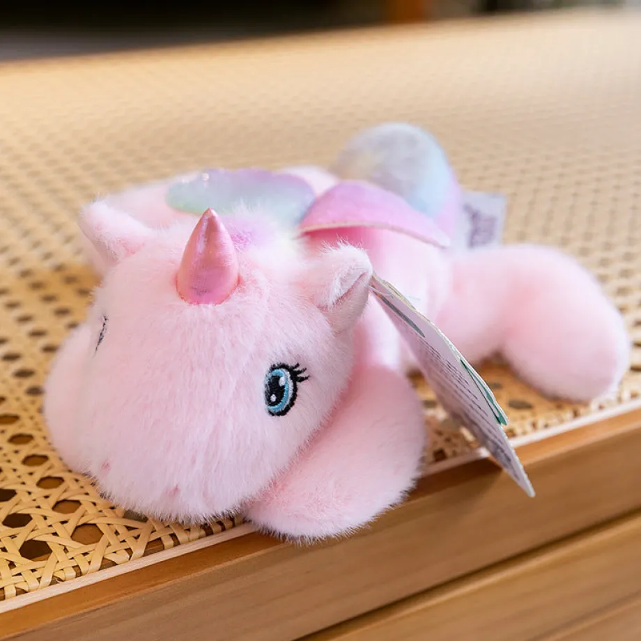 Peluche licorne rose allongée ultra douce avec ailes pailletées