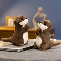 Peluche loutre aux mains jointes