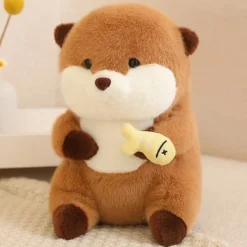 Peluche loutre qui tient un poisson coloré