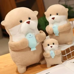 Peluche loutre tenant un poisson