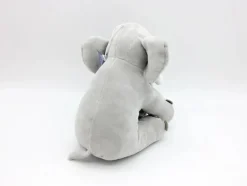 Peluche éléphant assis et content