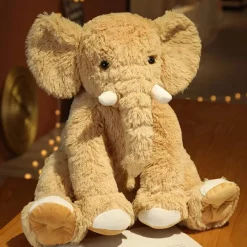 Peluche éléphant poilu aux petites défenses