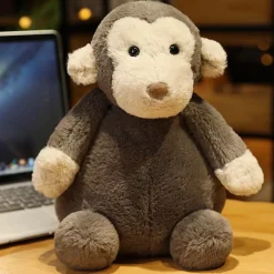 Peluche singe bébé assis