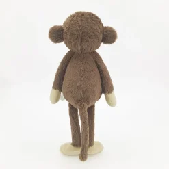 Peluche singe curieuse et attachante