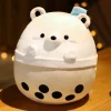 Peluche squishmallow ours blanc dans un bol